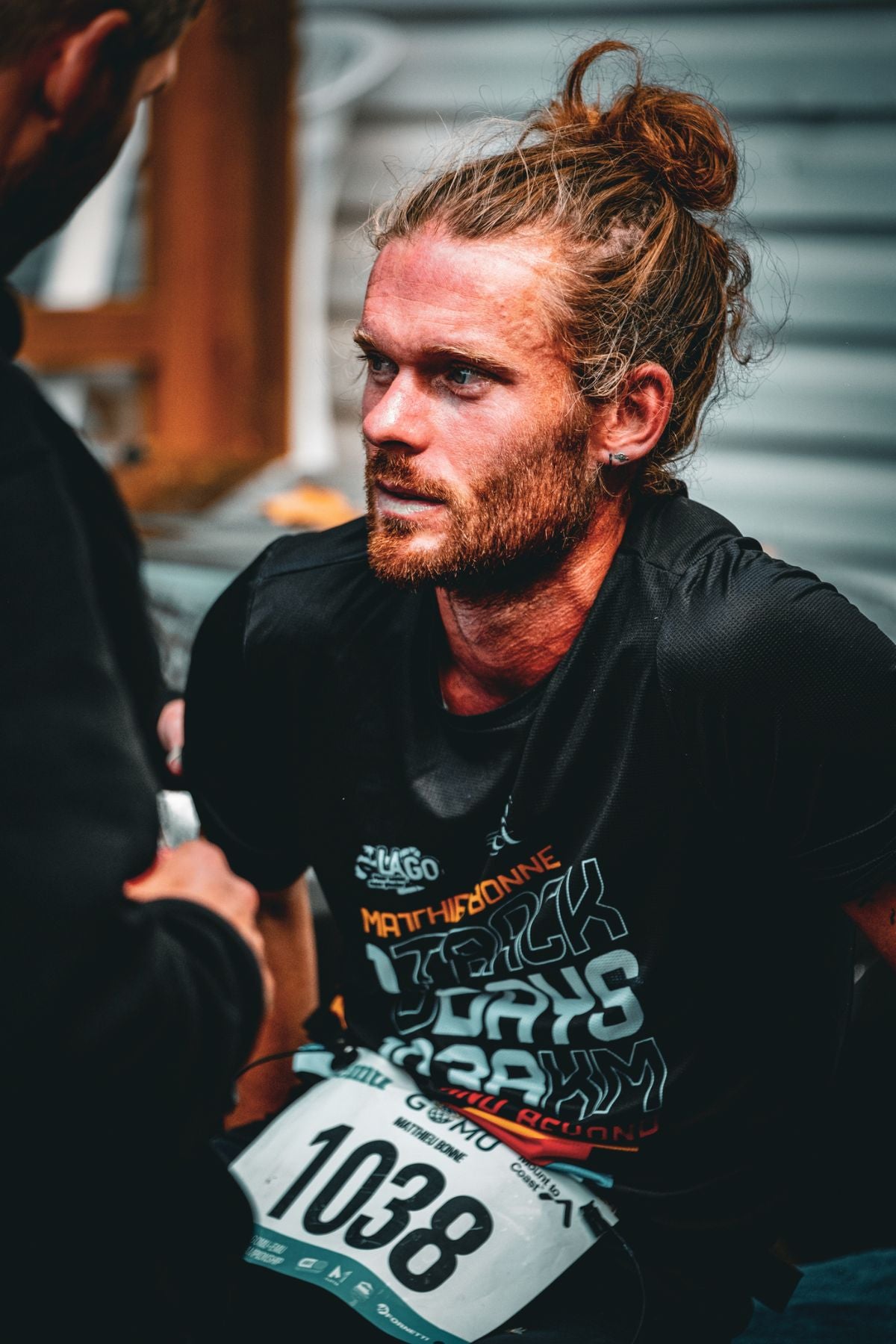 Close-up of a focused Matthieu Bonne resting after a race.