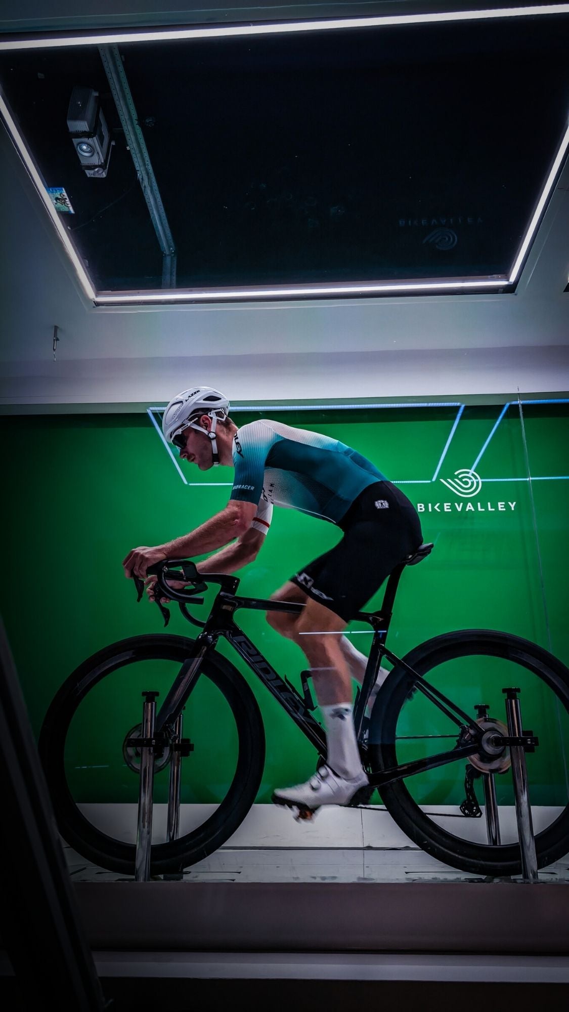 Side view of Ridley Racing Team cyclist in aero position during wind tunnel testing at Bikevalley