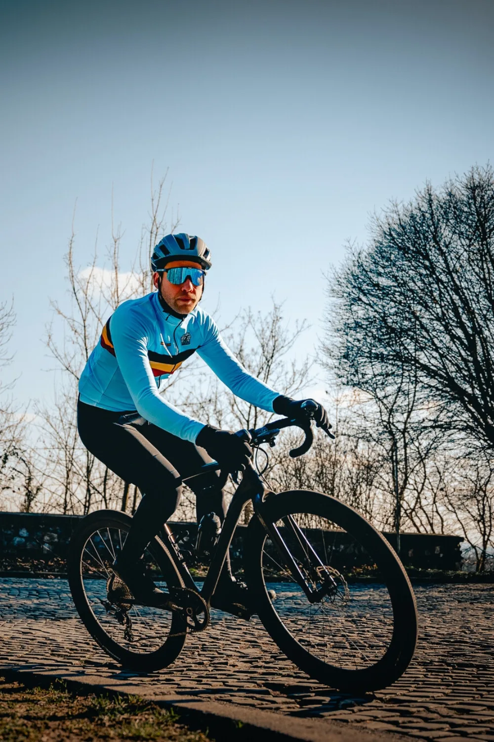 belgian cycling rider on cobbles